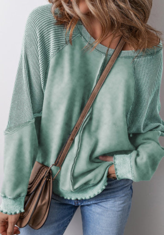 An emerald green comfy sweater