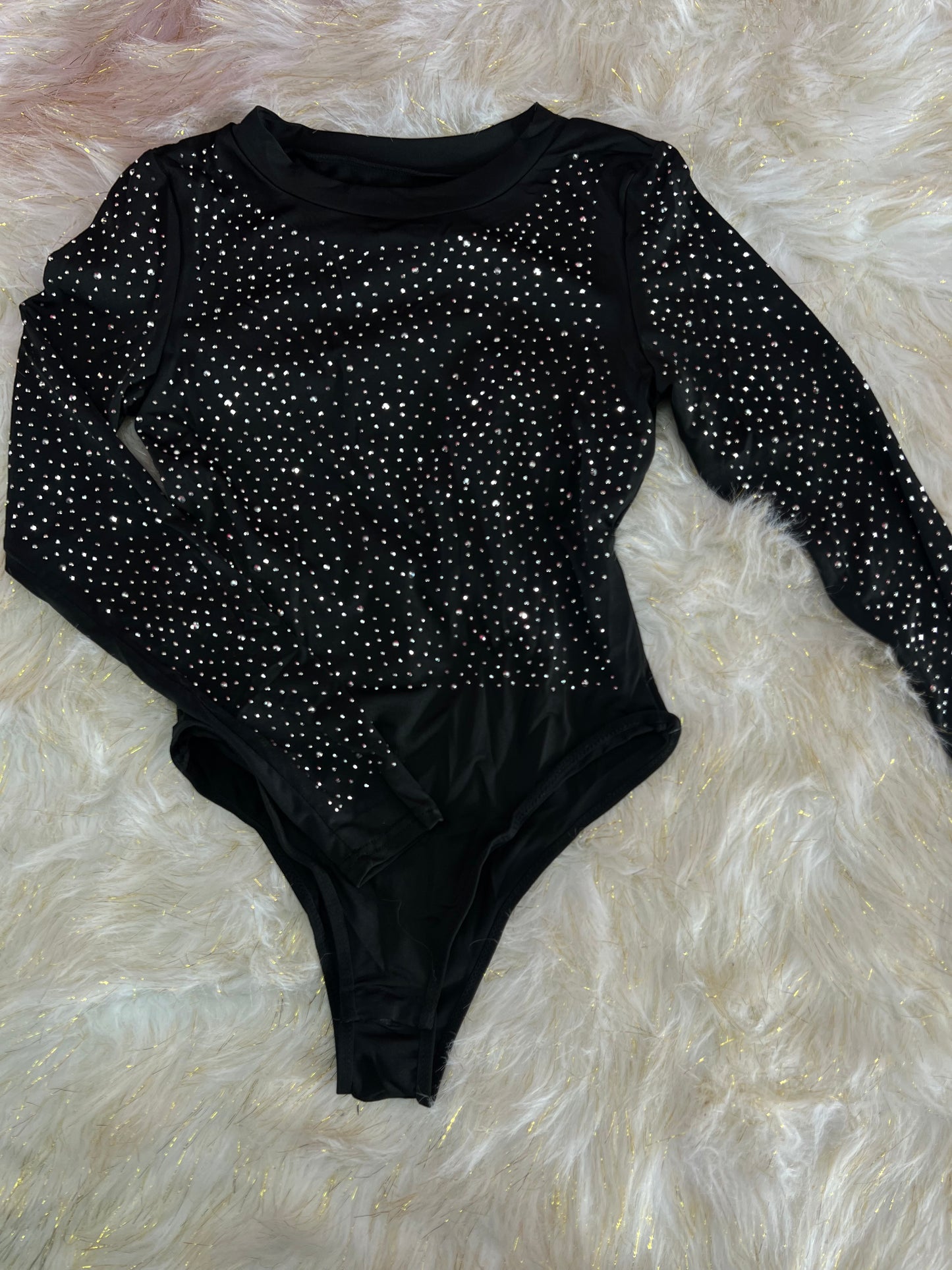 A rhinestone body suit